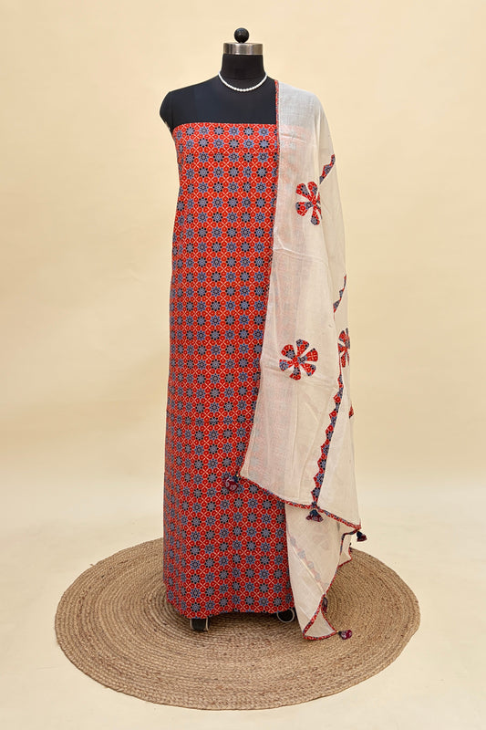 Orange Ajrakh Cotton Suit with Barmer Applique work dupatta